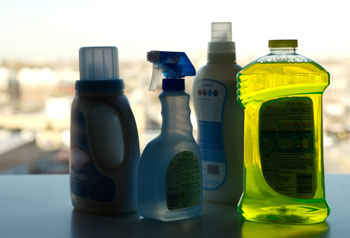Bottles of household cleaning products.