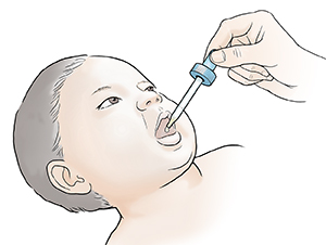 Adult giving liquid medicine from dropper into infant's mouth.