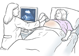 Health care provider doing ultrasound exam on pregnant patient.