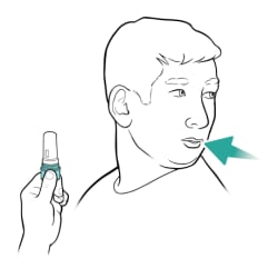 Person holding inhaler upright and away from mouth, breathing in.
