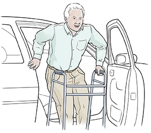 Person getting into car, holding on to side of car with one hand and walk handle with other, lowering self into seat.