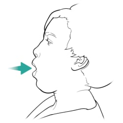 Person breathing in through mouth.